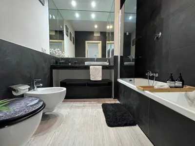 a bathroom with a sink and a toilet and a tub at Vatican Garden Oasi in Rome