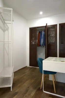 a room with a desk and a closet and a table at Vatican Garden Oasi in Rome
