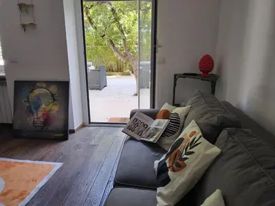 a living room with a couch and a fireplace at Vatican Garden Oasi in Rome