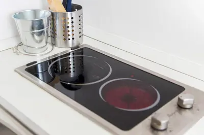 a kitchen counter with a stove with a sink at Perla - Cozy Apartment in Piazza Navona in Rome