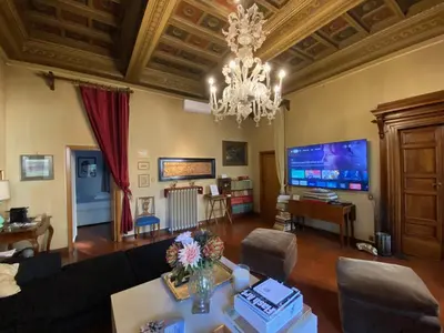 a large living room with a chandelier and a living room at 78 Luxury Margutta Suite in Rome