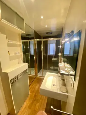 a bathroom with two sinks and a shower at 78 Luxury Margutta Suite in Rome