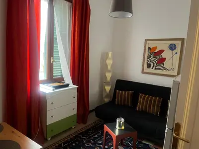 a living room with a couch and a window at Ranieri casa vacanze in Rome