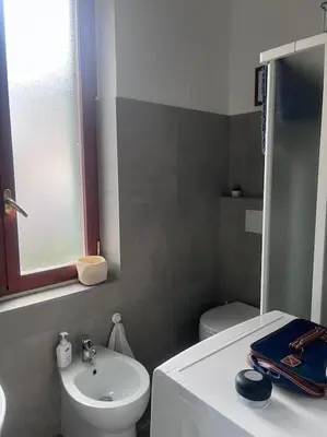 a small bathroom with a sink and a toilet at Ranieri casa vacanze in Rome