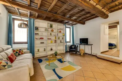 a living room with a couch and a table at Colosseum Dream Apartment in Rome
