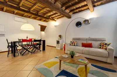 a living room with a couch and a table at Colosseum Dream Apartment in Rome
