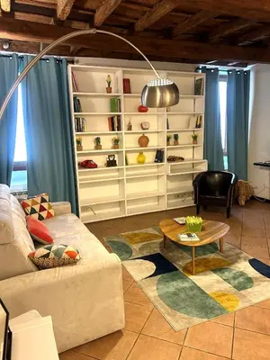 a living room with a couch and a table at Colosseum Dream Apartment in Rome