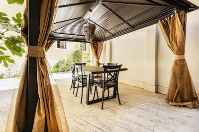 a dining room with a table and chairs at Videnda Colosseo in Rome