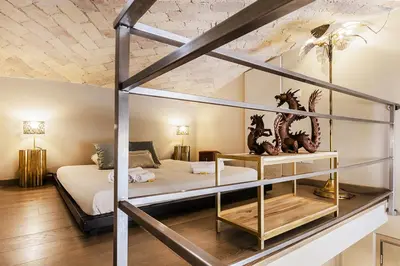 a bedroom with a bunk bed with a metal frame at Videnda Colosseo in Rome