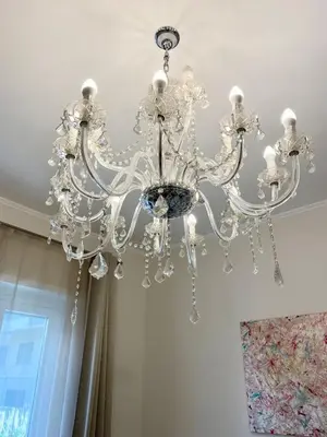 a chandelier hanging from a ceiling in a room at ARCA LUXURY HOME in Rome