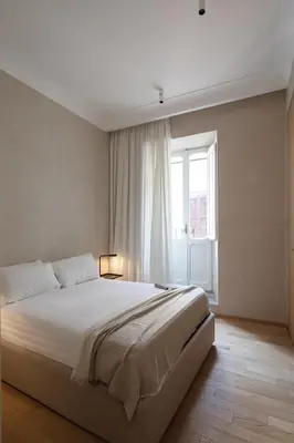 a bedroom with a large bed and a window at P10 DESIGN in Rome
