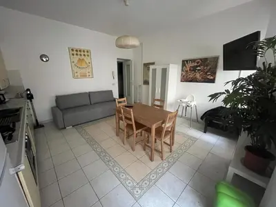 a living room with a table and a couch at Dolce Vita Suites in Rome