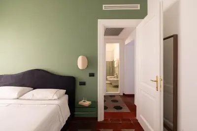 a bedroom with a bed and a bathroom at Welcome to Vatican in Rome