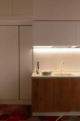a kitchen with a sink and a bottle of wine at Welcome to Vatican in Rome