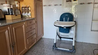 a high chair with a sink in a kitchen at In Vacanza dai Nonni in Rome