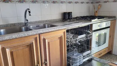 a kitchen with a dish rack in the dishwasher at In Vacanza dai Nonni in Rome