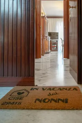 a welcome mat in theoyer of a house at In Vacanza dai Nonni in Rome