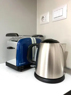 a tea kettle and toaster sitting on a counter at Residenza Santi ai Monti in Rome