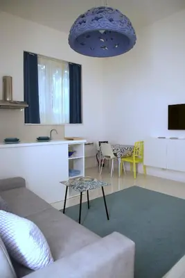 a living room with a couch and a table at Residenza Santi ai Monti in Rome