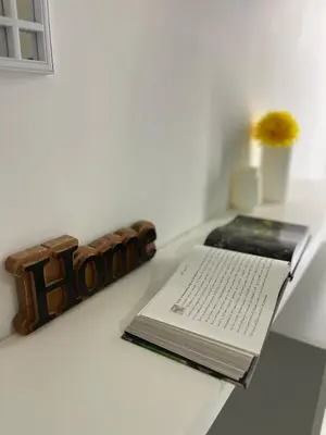 a book sitting on a table with ainylinylinylinylinylinylinylinyl at Residenza Santi ai Monti in Rome