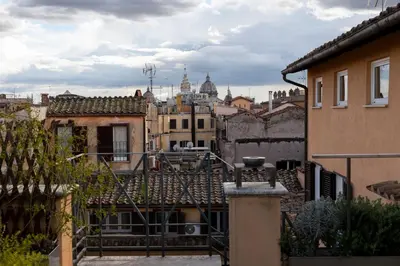 a view of the city from the roofs of buildings at Restart Accommodations Moro in Rome