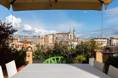 a table with a view of the city at Restart Accommodations Moro in Rome