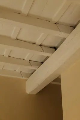 a ceiling in a room with white ceilings at Restart Accommodations Tritone in Rome