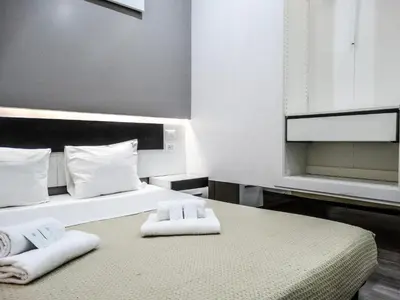 a bedroom with two beds with towels on them at Guesthouse o Affittacamere Casa Barberini in Rome