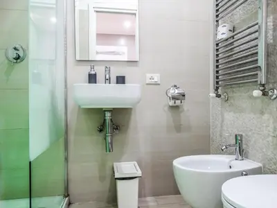 a bathroom with a sink and a toilet at Guesthouse o Affittacamere Casa Barberini in Rome