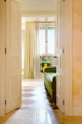 a bedroom with a bed with two red pillows at Casa Monti Roma in Rome