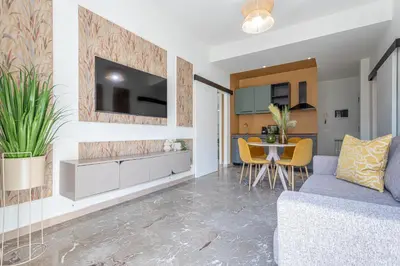 a living room with a couch and a table at Cornelia cozy home in Rome