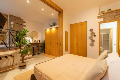a bedroom with a large bed in a room at Pearl of Circo Massimo in Rome