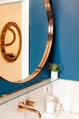 a bathroom with a mirror and a sink at Bright and cozy apartment near the Vatican city in Rome