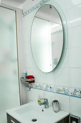 a bathroom with a sink and a mirror at Magnifico 122 Apartment in Rome