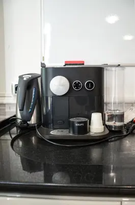 a coffee maker sitting on top of a counter at Magnifico 122 Apartment in Rome