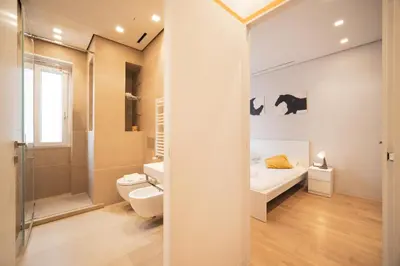 a bathroom with a bed and a shower and a toilet at Green Hill Buddyrent's in Rome