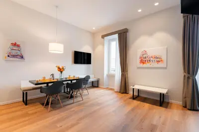a dining room with a table and chairs at Major House - Luxury Apartments in Rome by Hostand in Rome
