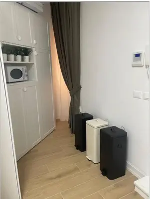 a hallway with two pieces of luggage in a room at Cola di Rienzo 243 Relais-B in Rome