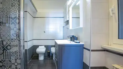 a bathroom with a sink and a toilet in it at EasyTopStay - Crescenzio Stylish Apartment in Rome