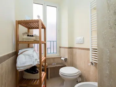 a bathroom with a toilet and a window at Apartment Vatican - Residenza Argilla by Interhome in Rome
