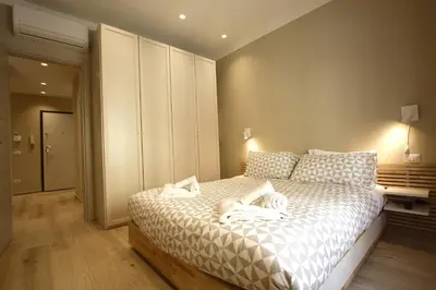 a bedroom with a bed with two dogs on it at Aniene Holiday House in Rome