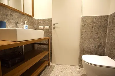 a bathroom with a sink and a toilet at Aniene Holiday House in Rome