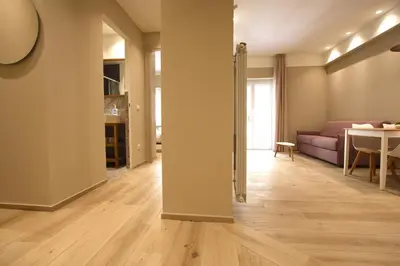 an empty living room with a couch and a table at Aniene Holiday House in Rome