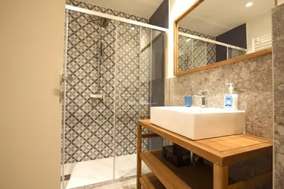 a bathroom with a sink and a shower at Aniene Holiday House in Rome