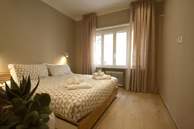 a bedroom with a bed with two towels on it at Aniene Holiday House in Rome