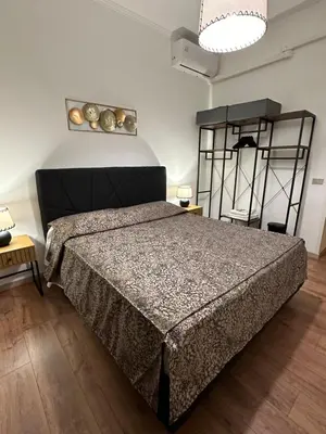 a bedroom with a large bed in a room at luna in trastevere apartamento in Rome