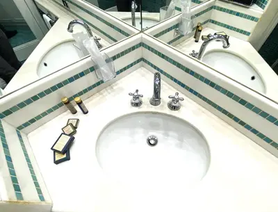 a bathroom with a sink and a toilet and a mirror at Vatican Modern Art apartment in Rome