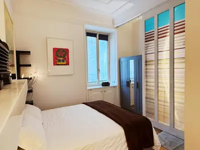 a window with a curtain in front of it at Vatican Modern Art apartment in Rome
