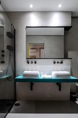 a bathroom with two sinks and a mirror at Restart Accommodations Trevi in Rome