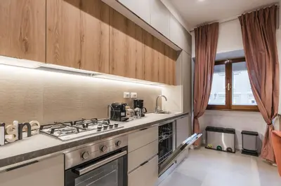 a kitchen with a stove and a sink at The Best in Rome Orologio in Rome